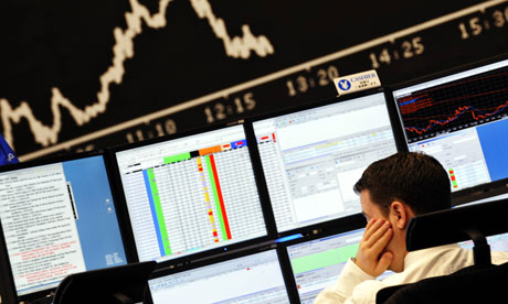 Stock broker at screens