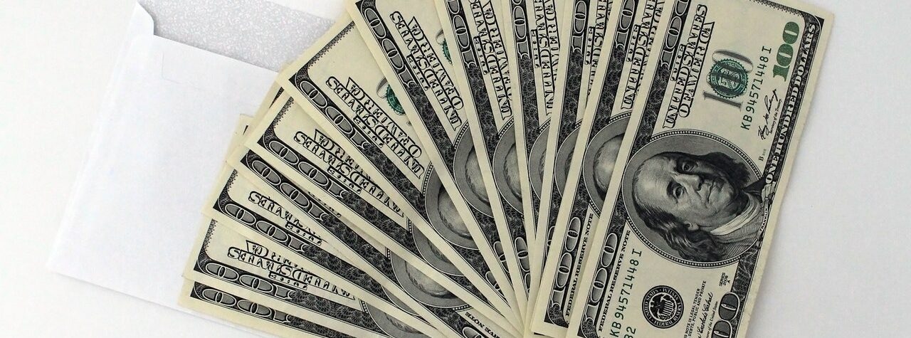 a stack of dollar bills